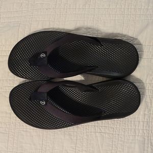 Black chaco flip flops